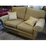 A contemporary mustard upholstered two seater settee, 160cm wide.