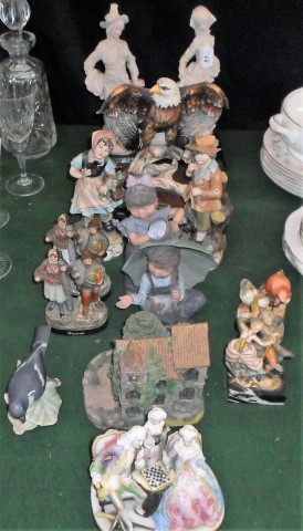 A mixed lot of decorative ceramics to include examples by: Royal Copenhagen, Hummel and others.