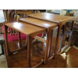 A mid-20th century set of three G-plan style nesting tables, the largest 53cm wide.