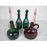 A pair of 19th century green glass decanters, labelled 'Rum' and 'Brandy', in gilt, 26cm tall,