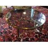 A brass circular coffee table, 76cm diameter.