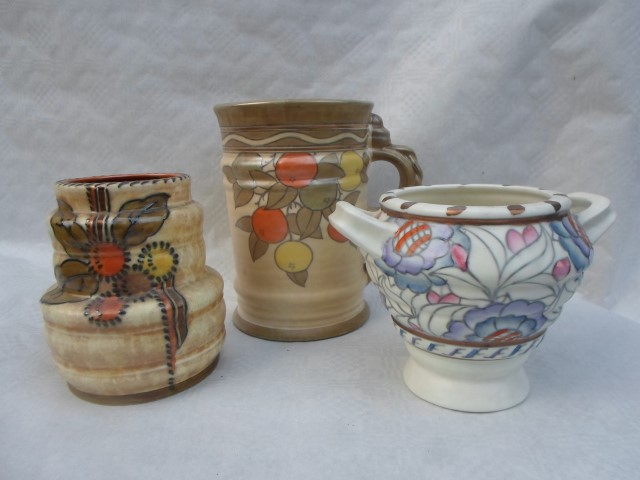 Three 1930s Crown Ducal vases, designed by Charlotte Rhead in the 5982 Circular Fruits,