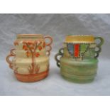 Two 1930s Crown Ducal vases, each of stepped form with twin handles (shape no.