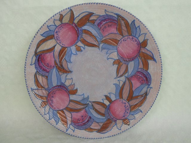 A 1930s Crown Ducal wall plaque, designed by Charlotte Rhead in the 3321 Granada pattern,