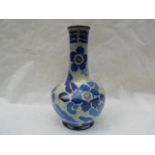 An early 20th century Royal Cauldon Cairo Ware bottle vase, designed by Frederick A Rhead,