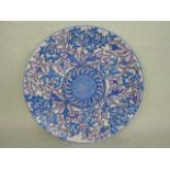 A large 1930s Crown Ducal wall plaque, designed by Charlotte Rhead in the 4016 Blue Peony pattern,