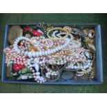 A quantity of costume jewellery, to include: brooches, necklaces and other items.