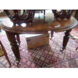 A Victorian mahogany circular dining table on reeded and turned supports, 124cm diameter.