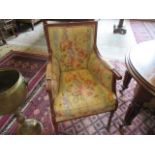 A reproduction walnut upholstered armchair, 62cm.