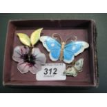 Four silver gilt and enamel butterfly brooches by David Andersen of Norway, largest 6.5cm wide.