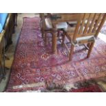 A large Eastern-style carpet, having fifteen central square form reserves with geometric border,