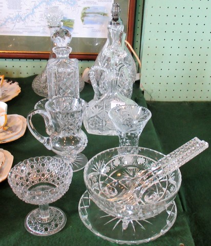 A good quantity of cut crystal glass, to include: a ship's decanter, table lamp,