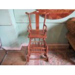 An early 20th century hardwood child's metamorphic highchair of Oriental origin, 53cm wide.