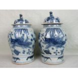 A pair of large 19th century Chinese baluster jars and covers,