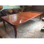 A large Victorian extending mahogany dining table,