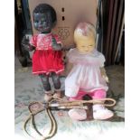Two early 20th century children's dolls, together with a skipping rope.