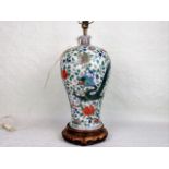 An early 20th century Chinese baluster vase, converted to a table lamp,