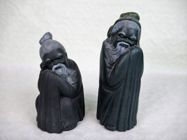 Two Lladro figurines, each modelled as Chinese elders, the tallest 21cm.