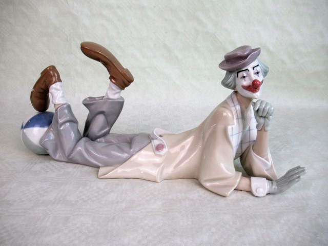 A Lladro model of a recumbent clown, no. 4618, 37.5cm wide.