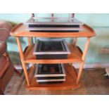 A three tier Ercol hostess trolley, 59cm wide.