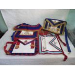 A collection of five assorted Masonic ceremonial aprons.