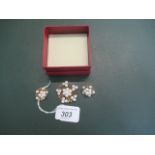A Mikimoto gold and cultured pearl cluster brooch en-suite,