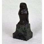 An early 20th century bronze desk weight, modelled as an owl, mounted to a stepped marble base,
