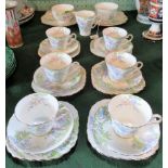 A Wellington bone china part-tea service, comprising: six trios, two sugar bowls,