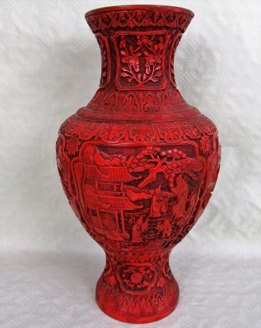 An early 20th century Chinese Cinnabar red lacquered baluster vase of imposing form,