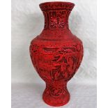 An early 20th century Chinese Cinnabar red lacquered baluster vase of imposing form,