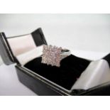 A diamond cluster ring,