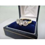 A three stone half-hoop diamond ring,