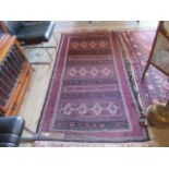 A rectangular Beluch carpet, 220cm x 120cm.