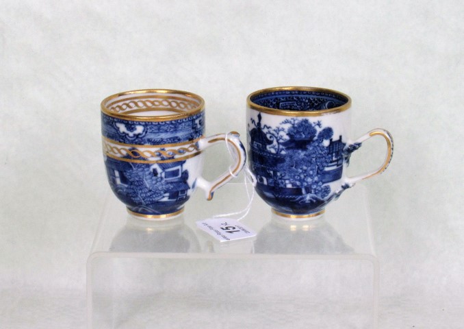 Two late 18th/early 19th century tea cups, each decorated in underglaze blue with gilt finish,