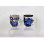 Two late 18th/early 19th century tea cups, each decorated in underglaze blue with gilt finish,