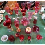 A large quantity of cranberry coloured glass, to include: vases, a scent bottle,