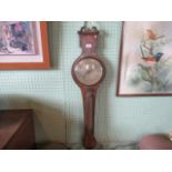 An inverted banjo barometer, having broken scroll pediment, over a silvered dial signed P Myers,