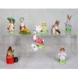 A collection of eight Beatrix Potter figurines,
