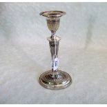 A silver candlestick of classical form, London hallmarks, 901.