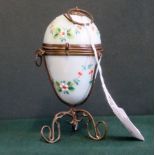 A 19th century French Palace Royale green opaline glass perfume egg casket, mounted in gilt frame,