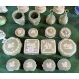 Sixteen pieces of Wedgwood Jasperware, each on a sage green ground,