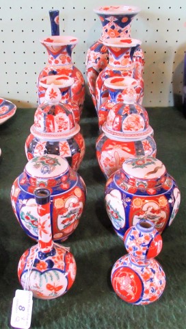Twelve pieces of Japanese Imari Ware, to include: vases and covered jars, the tallest 26cm.