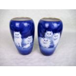 A pair of Grimwades Winton Ware vases, each depicting cats on a deep blue ground, signed B Austin,