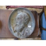 A Victorian cast metalware relief portrait plaque of a bearded gentleman, 44cm x 38cm.