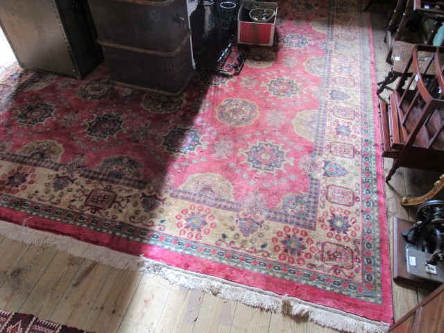 A large rectangular carpet of Eastern design, 345cm x 275cm.