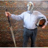 A large 'Excalibur' type sword, together with two reproduction armour helmets.