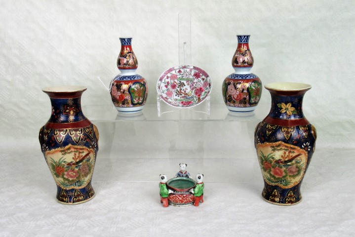 A pair of Japanese double gourd vases in the Imari palette, eight character marks to base,