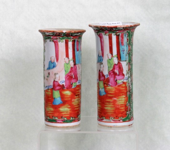 A pair of 19th century Cantonese Famille Rose vases of sleeve form,