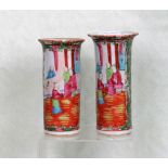 A pair of 19th century Cantonese Famille Rose vases of sleeve form,