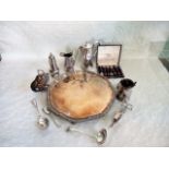 A silver plated tray on four supports,
